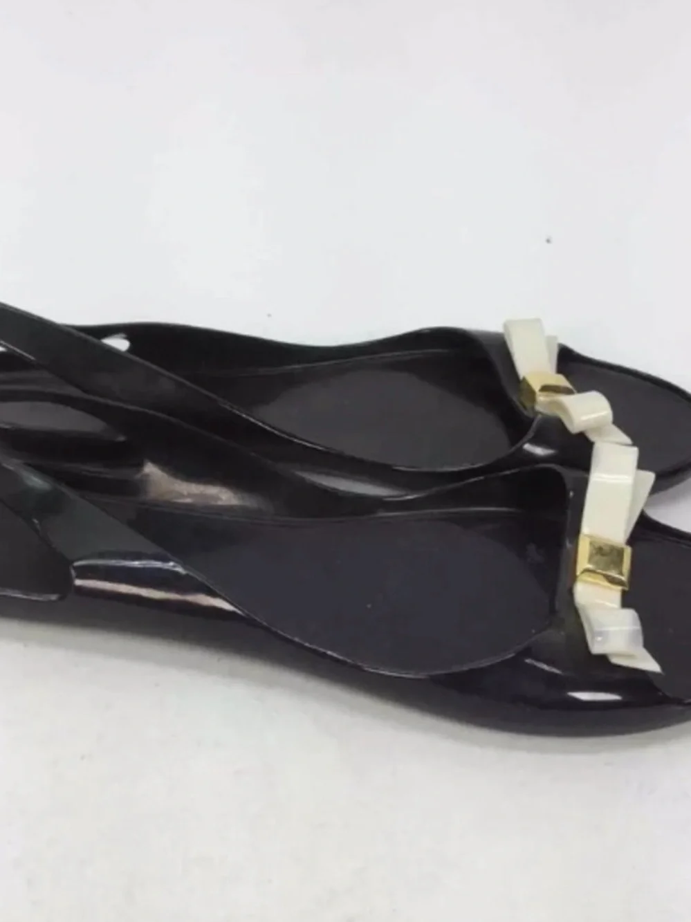 kate spade Black Jelly Flats with Cream Bow and Gold Accent